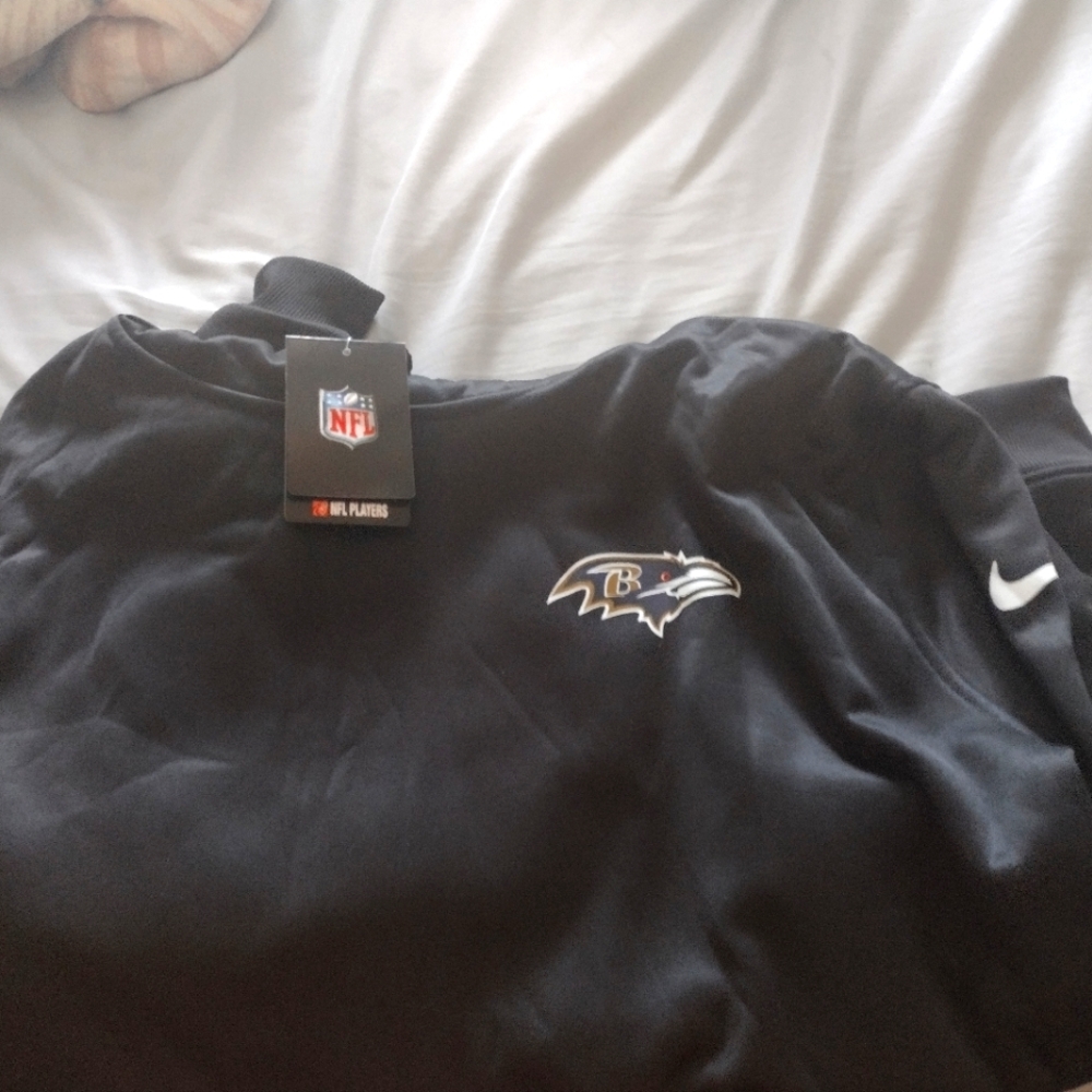 New Nike Balt Ravens pullover/ hoodie. New with tags.Says 4xl fits like a 2 xl